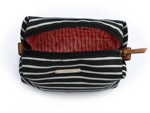 A picture of a luxury See Stylish item, a designer makeup bag