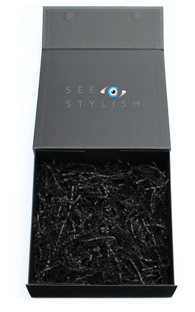 A picture of an opened See Stylish box that typically includes designer sunglasses and contact lenses