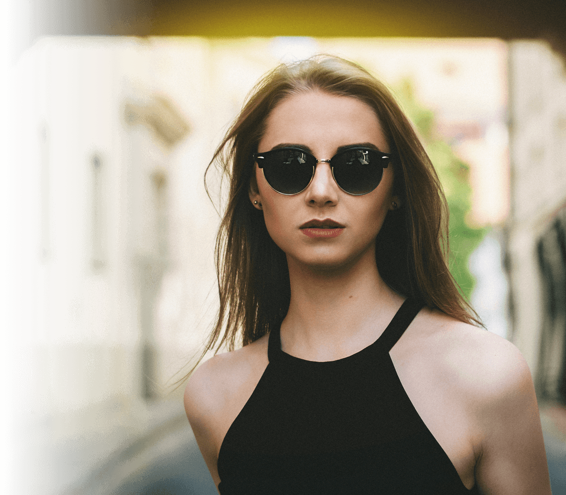 A photo of a stylish woman wearing designer sunglasses